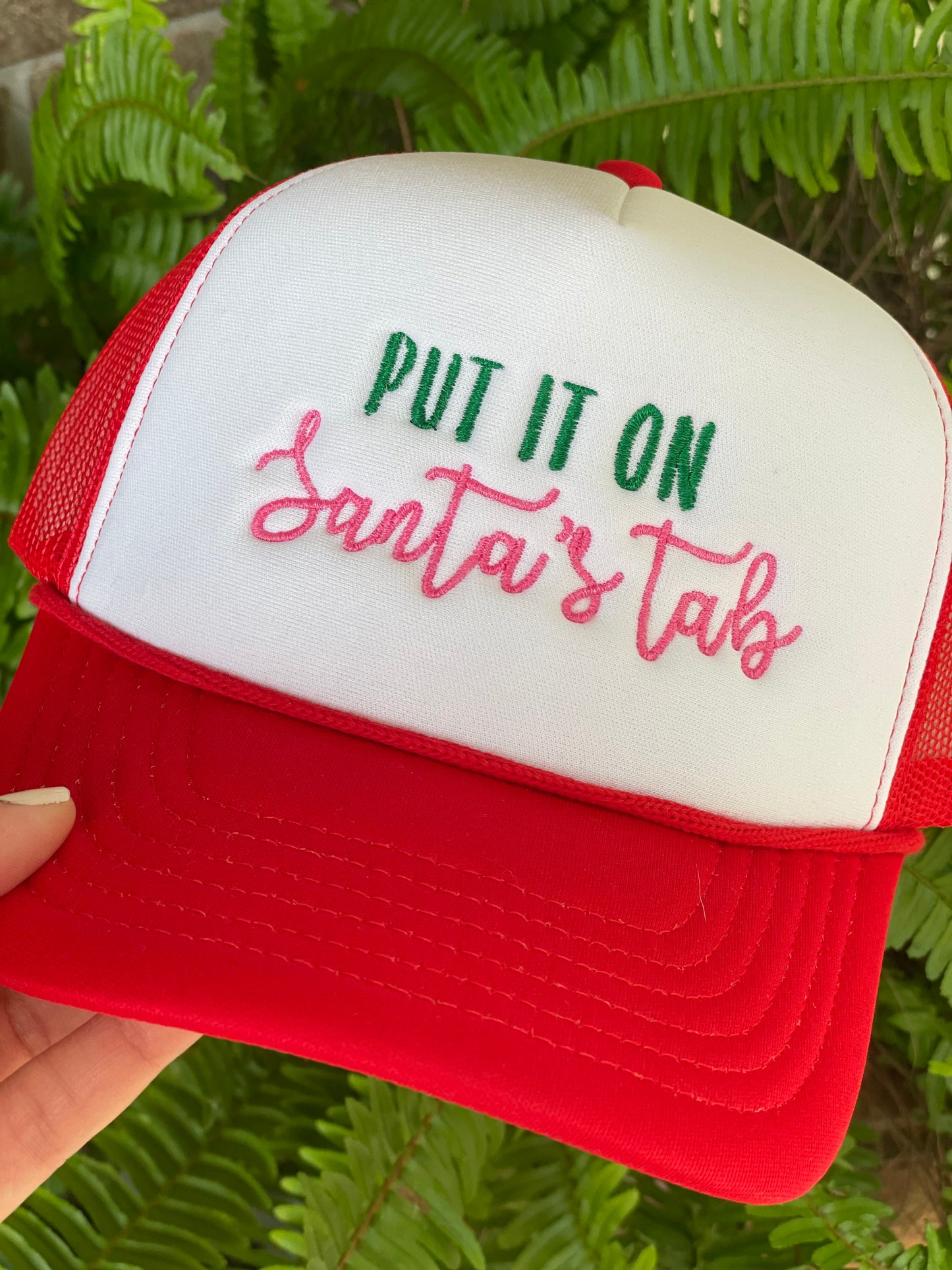 Put it on Santa’s tab red foam trucker cap